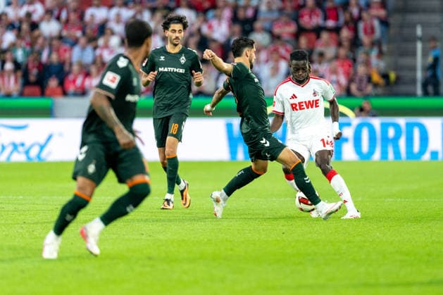 Eren Dinkci (SV Werder Bremen, 18), Ludovit Reis (SV Werder Bremen, 15) im Zweikampf mit Gideon Mensah (1.FC Koeln, 14) 1.FC Köln vs. SV Werder Bremen, Fussball, Bundesliga, 3.Spieltag, Saison 2026 27, 12.09.2026, DFL REGULATIONS PROHIBIT ANY USE OF PHOTOGRAPHS AS IMAGE SEQUENCES AND OR QUASI-VIDEO, 1.FC Köln vs. SV Werder Bremen, Fussball, Bundesliga, 3.Spieltag, Saison 2026 27, 12.09.2026 Köln *** Eren Dinkci, SV Werder Bremen, 18, Ludovit Reis, SV Werder Bremen, 15, in a tackle with Gideon Mensah, 1. FC Köln, 14. 1. FC Köln vs. SV Werder Bremen, Soccer, Bundesliga, Matchday 3, 2026–27 Season, September 12, 2026, DFL regulations prohibit any use of photographs as image sequences and or quasi-video, 1. FC Köln vs. SV Werder Bremen, Soccer, Bundesliga, Matchday 3, 2026–27 Season, September 12, 2026, Cologne Copyright: xEibner-Pressefoto LukasxBaldygax EP_LBA