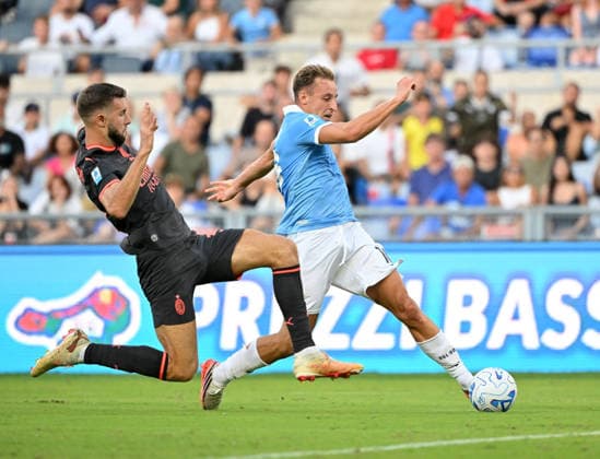 IPA88449753 - Lazio s Davide Frattesi and AC Milan s Strahinja Pavlovic during the 2026–2027 Serie A match between SS Lazio and AC Milan at the Olympic Stadium in Rome on September 12, 2026.  Copyright: xFabrizioxCorradetti IPAxSportx xx IPA88449753