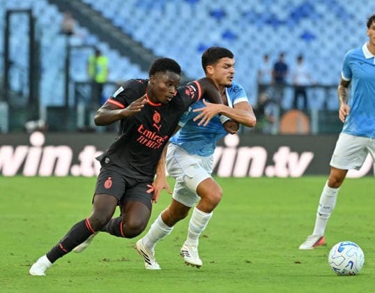 IPA88449756 - Lazio s Reda Belahyane battles for the ball with Milan s Alphadjo Cisse during the 2026–2027 Italian Serie A match between SS Lazio and AC Milan at the Olympic Stadium in Rome on September 12, 2026.  Copyright: xFabrizioxCorradetti IPAxSportx xx IPA88449756