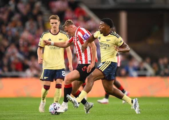 Myles Lewis-Skelly of Arsenal challenges Dan Ballard of Sunderland Sunderland v Arsenal, Premier League, Football, Football, Stadium of Light, Sunderland, UK - 12 Sep 2026Sunderland Stadium of Light United Kingdom EDITORIAL USE ONLY No use with unauthorised audio, video, data, fixture lists, club league logos or live services. Online in-match use limited to 120 images, no video emulation. No use in betting, games or single club league player publications.  Copyright: xRichardxLee Shutterstockx 17144590s