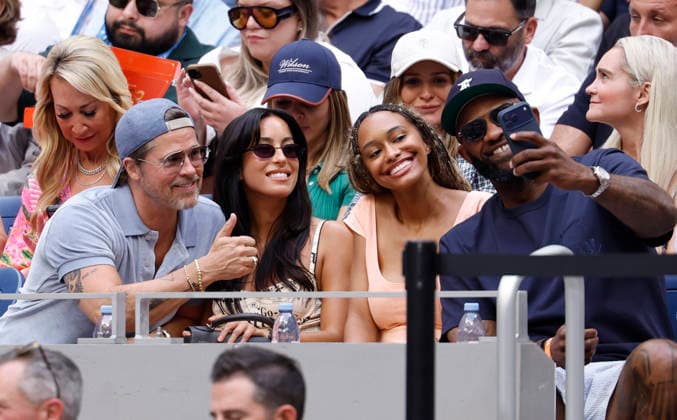 Actor Brad Pitt takes a selfie with Ines de Ramon and others as they watch the Women s Finals match in Arthur Ashe Stadium at the 2026 US Open Tennis Championship at the USTA Billie Jean King National Tennis Center in New York City on Saturday, September 12, 2026.  NYP20260912608 JOHNxANGELILLO