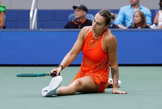Aryna Sabalenka of Belarus falls after hitting a return to Elena Rybakina of Kazakhstan in the second set of the Women s Finals match in Arthur Ashe Stadium at the 2026 US Open Tennis Championship at the USTA Billie Jean King National Tennis Center in New York City on Saturday, September 12, 2026.  NYP20260912837 JOHNxANGELILLO