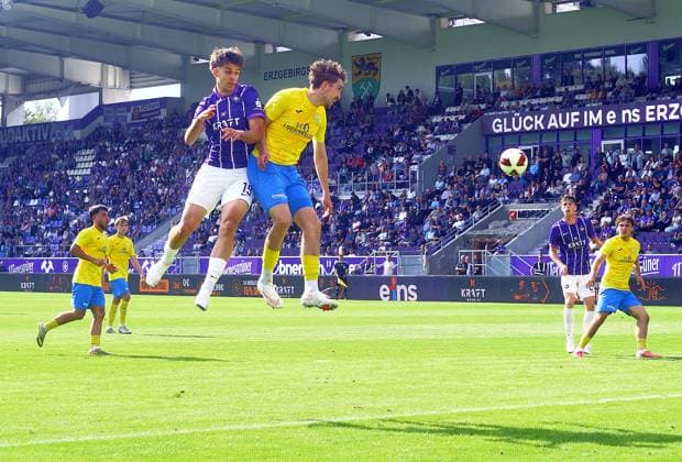 Christoph Pauling Aue, on the left in a header duel with Sofiene Jannene Luckenwalde Soccer Northeast Regional League 2026–27 FC Erzgebirge Aue vs. FSV Luckenwalde 2–1 on September 12, 2026 Erzgebirge Aue vs. FSV Luckenwalde