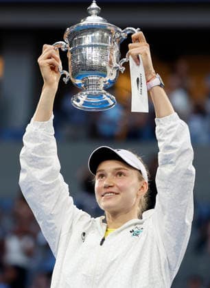 Elena Rybakina of Kazakhstan raises her trophy after defeating Aryna Sabalenka of Belarus in the Women s Finals match in Arthur Ashe Stadium at the 2026 US Open Tennis Championship at the USTA Billie Jean King National Tennis Center in New York City on Saturday, September 12, 2026. Rybakina won with a score of 6-4, 5-7, 6-2.  NYP20260912869 JOHNxANGELILLO