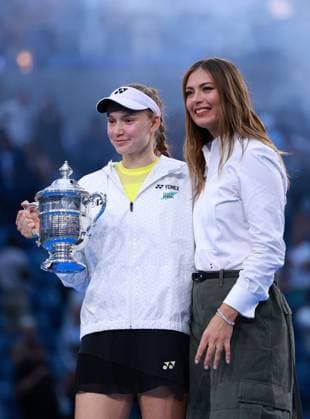 Elena Rybakina of Kazakhstan celebrates with the trophy next to Maria Sharapova 2026 US Open, Day Fourteen, USTA Billie Jean King National Tennis Center, New York, USA - 12 Sep 2026New York USTA Billie Jean King National T New York (NY) United States of America EDITORIAL USE ONLY No use with unauthorised audio, video, data, fixture lists, club league logos or live services. Online in-match use limited to 120 images, no video emulation. No use in betting, games or single club league player publications. Copyright: xEllaxLing Shutterstockx 17140165bv