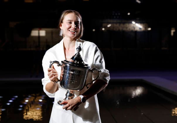 Elena Rybakina of Kazakhstan holds the championship trophy at the fountains in front of Arthur Ashe Stadium after defeating Aryna Sabalenka of Belarus in the Women s Finals match at the 2026 US Open Tennis Championship at the USTA Billie Jean King National Tennis Center in New York City on Saturday, September 12, 2026. Rybakina won with a score of 6-4, 5-7, 6-2.  NYP20260913009 JOHNxANGELILLO