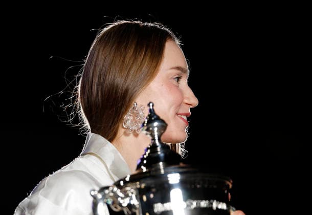 Elena Rybakina of Kazakhstan holds the championship trophy at the fountains in front of Arthur Ashe Stadium after defeating Aryna Sabalenka of Belarus in the Women s Finals match at the 2026 US Open Tennis Championship at the USTA Billie Jean King National Tennis Center in New York City on Saturday, September 12, 2026. Rybakina won with a score of 6-4, 5-7, 6-2.  NYP20260913014 JOHNxANGELILLO