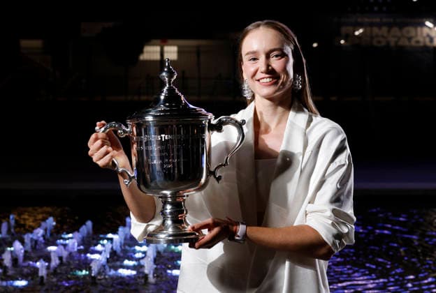 Elena Rybakina of Kazakhstan holds the championship trophy at the fountains in front of Arthur Ashe Stadium after defeating Aryna Sabalenka of Belarus in the Women s Finals match at the 2026 US Open Tennis Championship at the USTA Billie Jean King National Tennis Center in New York City on Saturday, September 12, 2026. Rybakina won with a score of 6-4, 5-7, 6-2.  NYP20260913207 JOHNxANGELILLO