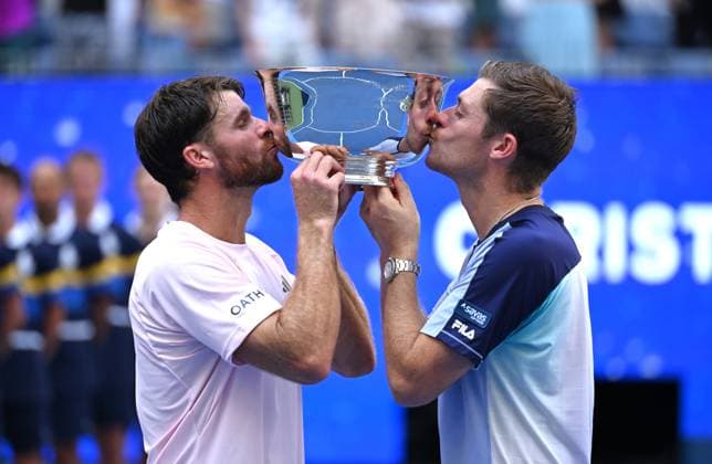 (260913) -- NEW YORK, Sept. 13, 2026 -- Christian Harrison (L) Neal Skupski kiss the trophy during the awarding ceremony after the men s doubles final match between Christian Harrison (the United States) Neal Skupski (Britain) and Kevin Krawietz Tim Puetz of Germany at the 2026 US Open tennis championships in New York, the United States, Sept. 12, 2026. ) (SP)U.S.-NEW YORK-TENNIS-US OPEN-MEN S DOUBLES-FINAL LixRui 