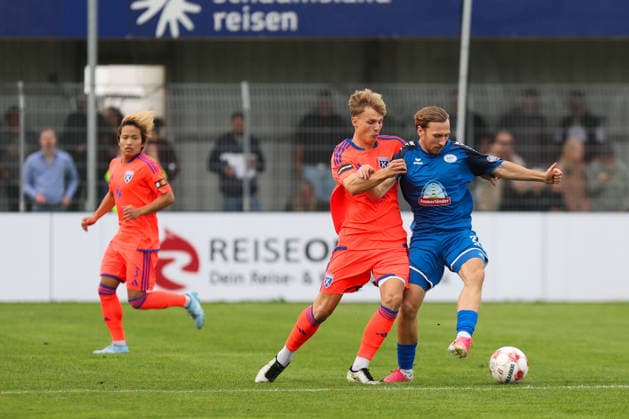 September 12, 2026, Soccer, Men s, Regionalliga Nord, Matchday 8, BSV Kickers Emden vs. SSV Jeddeloh II Marvin Benjamin in orange 19 BSV Kickers Emden in a tackle with Tim Janßen 20 SSV Jeddeloh II