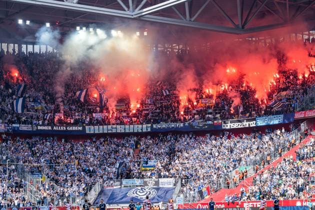 MSV Duisburg away section with fire, smoke, and flares: Fortuna Düsseldorf vs. MSV Duisburg, soccer, 3. Liga, Matchday 5, 2026–27 season, September 12, 2026, DFL regulations prohibit any use of photographs as image sequences and or quasi-video, Fortuna Düsseldorf vs. MSV Duisburg, soccer, 3. Liga, Matchday 5, 2026–27 season, September 12, 2026, Düsseldorf Copyright: xEibner-Pressefoto LukasxBaldygax EP_LBA