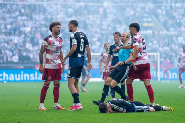 Fabian Schleusener of Fortuna Düsseldorf (No. 24) and Rasim Bulic of MSV Duisburg (No. 06) collide; referee Patrick Schwenger stops Yassine Bouchama of Fortuna Düsseldorf (No. 05), Can Coskun (MSV Duisburg, 27) is on the ground with his hands over his eyes; Fortuna Düsseldorf vs. MSV Duisburg, soccer, 3. Liga, Matchday 05, 2026–27 season, September 12, 2026, DFL regulations prohibit any use of photographs as image sequences and or quasi-video; Fortuna Düsseldorf vs. MSV Duisburg, soccer, 3. Liga, Matchday 5, 2026–27 season, September 12, 2026, Düsseldorf Copyright: xEibner-Pressefoto LukasxBaldygax EP_LBA