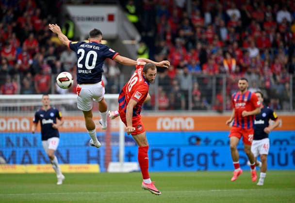 Heading duel, tackle, action: Adrian Kapralik (Holstein Kiel 20) vs. Jonas Foehrenbach (1 FC Heidenheim 1846 FCH 19), 1 FC Heidenheim 1846 FCH vs. Holstein Kiel KSV, September 13, 2026, DFL REGREGULATIONS PROHIBIT ANY USE OF PHOTOGRAPHS AS IMAGE SEQUENCES AND OR QUASI-VIDEO 1 FC Heidenheim 1846 FCH vs. Holstein Kiel KSV