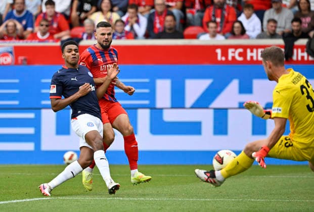 Shot on Goal, Scoring Opportunity: Ikem Ugoh (Holstein Kiel 27) vs. Goalkeeper Thomas Daehne (1 FC Heidenheim 1846 FCH 33), 1 FC Heidenheim 1846 FCH vs. Holstein Kiel KSV, September 13, 2026, DFL REGULREGULATIONS PROHIBIT ANY USE OF PHOTOGRAPHS AS IMAGE SEQUENCES AND OR QUASI-VIDEO 1 FC Heidenheim 1846 FCH vs. Holstein Kiel KSV