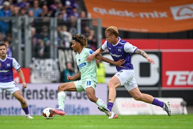 2. Bundesliga, Matchday 26, VfL Osnabrück vs. Hertha BSC Berlin on September 13, 2026, at Bremer Brücke in Osnabrück; Oluwaseun Adewumi (Berlin) in a tackle against Bjarke Jacobsen (Osnabrück) MT