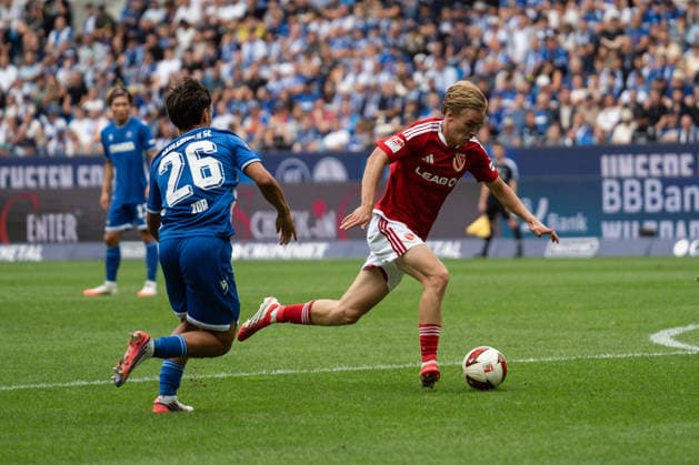 September 13, 2026, xjyhynx, Soccer 2. Bundesliga, Karlsruher SC vs. Energie Cottbus, Danyal Zor 26, Karlsruher SC in a tackle with Lukas Michelbrink 8, Energie Cottbus. DFL and DFB regulations prohibit any use of photographs as image sequences and or quasi-video. Karlsruhe