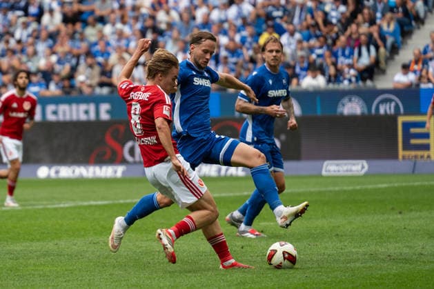 September 13, 2026, xjyhynx, Soccer 2. Bundesliga, Karlsruher SC vs. Energie Cottbus, Goals scored by Lukas Michelbrink (8) and Christoph Kobald (22), Karlsruher SC attempts to block. DFL and DFB regulations prohibit any use of photographs as image sequences and or quasi-video. Karlsruhe
