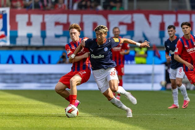 Fierce tackle by Michael Heule (1. FC Heidenheim, 27) on Hiroki Sekine (Holstein Kiel, 32), GER, 1. FC Heidenheim vs. Holstein Kiel, Soccer, 2. Bundesliga, Matchday 5, 2026–2027 season, September 13, 2026, DFL and DFB regulations prohibit any use of photographs as image sequences and or quasi-video, GER, 1 FC Heidenheim vs. Holstein Kiel, Soccer, 2. Bundesliga, Matchday 5, 2026–2027 season, September 13, 2026, Heidenheim Copyright: xEibner-Pressefoto JanixPlessx EP_JPL
