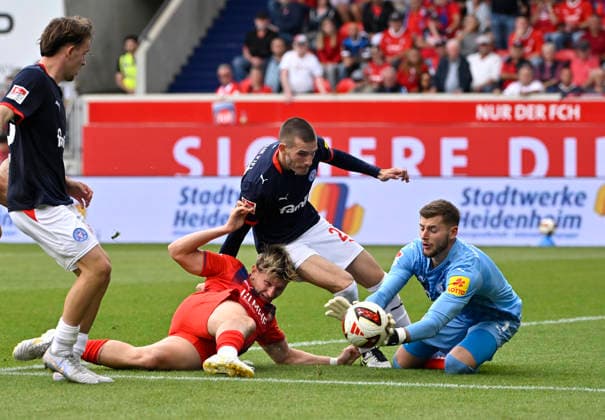 Penalty area play, Goal-area scene, shot on goal, scoring opportunity: Alessandro Vogt (1 FC Heidenheim 1846 FCH 18) against goalkeeper Timon Weiner (Holstein Kiel 01), Adrian Kapralik (Holstein Kiel 20), 1 FC Heidenheim 1846 FCH vs. Holstein Kiel KSV 13 09 2026 DFL regulations prohibit any use of photographs as image sequences and or quasi-video 1 FC Heidenheim 1846 FCH vs. Holstein Kiel KSV