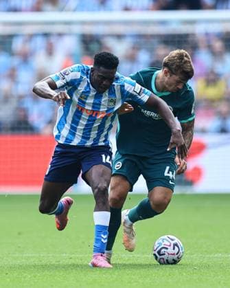 Aurele Amenda of Coventry City battles with b40 Coventry City v Brighton and Hove Albion, Premier League, Football, Football, Coventry Building Society Arena, Coventry, UK - 13 Sep 2026Coventry Coventry Building Society Arena United Kingdom EDITORIAL USE ONLY No use with unauthorised audio, video, data, fixture lists, club league logos or live services. Online in-match use limited to 120 images, no video emulation. No use in betting, games or single club league player publications.  Copyright: xMichaelxZemanek Shutterstockx 17144597ad