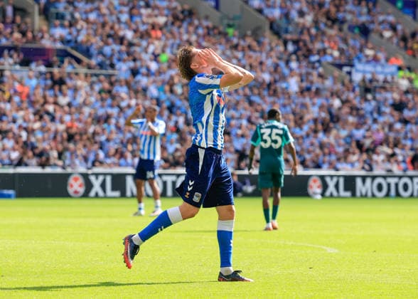 Coventry, England, 13th September 2026. Jack Rudoni of Coventry City reacts to a miss chance on goal during the Coventry City vs Brighton and Hove Albion Premier League match at the Coventry Building Society Arena, Coventry. Picture credit should read: Cody Froggatt Sportimage EDITORIAL USE ONLY. No use with unauthorised audio, video, data, fixture lists, club league logos or live services. Online in-match use limited to 120 images, no video emulation. No use in betting, games or single club league player publications. SPI_017_CF_COVENTRY_CITY_V_BRIGHTON SPI-4994-0017