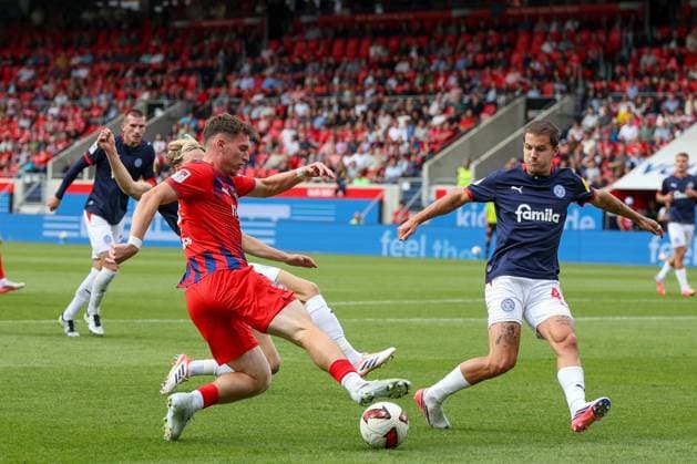 Paul Hennrich 8 (1. FC Heidenheim 1846) in action against John Tolkin 47 (Holstein Kiel), 1. FC Heidenheim 1846 vs. Holstein Kiel, Soccer, DFL, 2. Bundesliga, 2026–2027 season, First Half of the Season, Matchday 5, September 13, 2026, Heidenheim, Baden-Württemberg, Germany Copyright: xkolbert-press MartinxAgüerax