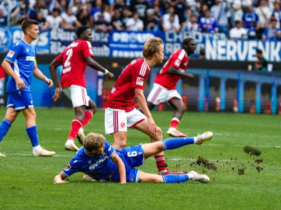 September 13, 2026, xwppx, Soccer 2. Bundesliga, Karlsruher SC vs. Energie Cottbus: Tackle between Santeri Väänänen (Karlsruher SC) and Lukas Michelbrink (Energie Cottbus). DFL and DFB regulations prohibit any use of photographs as image sequences and or quasi-video. Karlsruhe