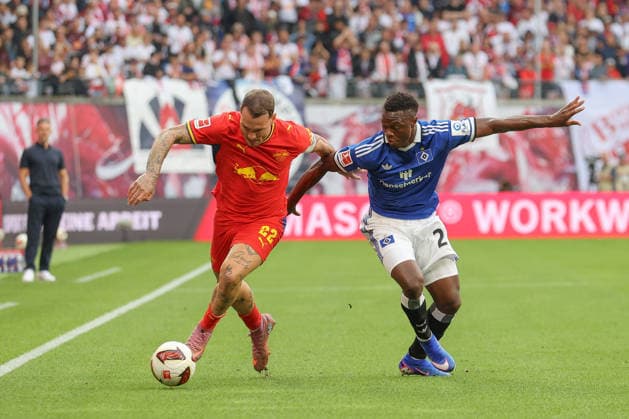 September 13, 2026, xtgx, Soccer, 1st Bundesliga, RB Leipzig vs. Hamburger SV, from left: David Raum (Leipzig), 22, Patson Daka (Hamburg), 27; tackle, duel, battle, DFL and DFB regulations prohibit any use of photographs as image sequences and or quasi-video (Leipzig)