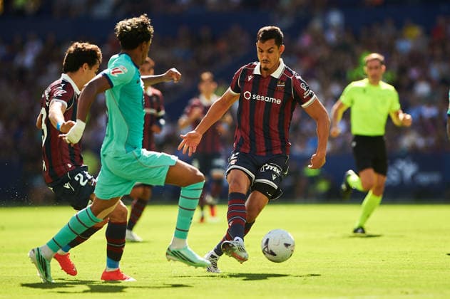 Lamine Yamal of FC Barcelona and Aissa Mandi of Levante UD during the LaLiga EA Sports match between Levante UD and FC Barcelona at Estadi Ciutat de Valencia on September 13, 2026, in Valencia, Spain
