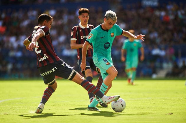 Aissa Mandi of Levante UD and Pedri Gonzalez of FC Barcelona during the LaLiga EA Sports match between Levante UD and FC Barcelona at Estadi Ciutat de Valencia on September 13, 2026, in Valencia, Spain