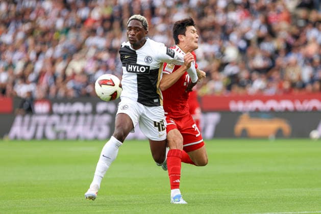 David Mokwa of SV 07 Elversberg and Min Jae Kim of FC Bayern Munich battle for the ball during the Bundesliga 1 match between SV Elversberg and FC Bayern Munich at the Ursapharm Arena on September 13, 2026, in Spiesen-Elversberg, Germany. Photo by Oliver Kaelke, DeFodi Images. David Mokwa of SV 07 Elversberg and Min Jae Kim of FC Bayern Munich battle for the ball during the Bundesliga match between SV Elversberg and FC Bayern Munich at Ursapharm Arena on September 13, 2026 in Spiesen-Elversberg, Germany. Photo by Oliver Kaelke, DeFodi Images. DFB and DFL regulations prohibit any use of photographs as image sequences and or quasi-video. Photo by Oliver Kaelke, DeFodi Images.