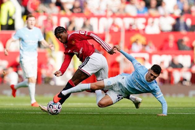 Manchester, England, 13th September 2026. Marcus Rashford of Manchester United, ManU with Phil Foden of Manchester City during the Manchester United vs Manchester City Premier League match at Old Trafford, Manchester. Picture credit should read: Andrew Yates Sportimage EDITORIAL USE ONLY. No use with unauthorised audio, video, data, fixture lists, club league logos or live services. Online in-match use limited to 120 images, no video emulation. No use in betting, games or single club league player publications. SPI_022_AY_MAN_UTD_MAN_CITY SPI-4993-0023