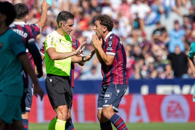 ESP LaLiga EA Sports UD Levante vs. FC Barcelona: Referee Jon Ander Gonzalez and Levante s Jon Ander Olasagasti during the LaLiga EA Sports match between UD Levante and FC Barcelona, played at the Ciudad de Valencia Stadium in Valencia on September 12, 2026, in Valencia, Spain. Soccer Copyright: xAgenciaxLOFx