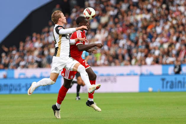 Cole Campbell of SV 07 Elversberg and Dayot Upamecano of FC Bayern Munich battle for the ball during the Bundesliga 1 match between SV Elversberg and FC Bayern Munich at the Ursapharm Arena on September 13, 2026, in Spiesen-Elversberg, Germany Photo by Oliver Kaelke DeFodi Images Cole Campbell of SV 07 Elversberg and Dayot Upamecano of FC Bayern Munich battle for the ball during the Bundesliga match between SV Elversberg and FC Bayern Munich at Ursapharm Arena on September 13, 2026 in Spiesen-Elversberg, Germany. Photo by Oliver Kaelke, DeFodi Images. DFB and DFL regulations prohibit any use of photographs as image sequences and or quasi-video. Photo by Oliver Kaelke, DeFodi Images.