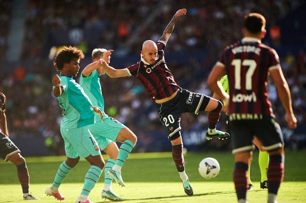 Oriol Rey of Levante UD and Karim Adeyemi of FC Barcelona during the LaLiga EA Sports match between Levante UD and FC Barcelona at Estadi Ciutat de Valencia on September 13, 2026, in Valencia, Spain