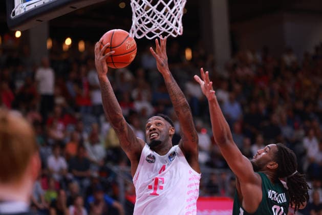 Jeff Garrett of Bonn goes for the ball against Devin McGlockton of Nanterre, Bonn, Germany, September 13, 2026, Basketball, Exhibition Game, Telekom Baskets Bonn vs. Nanterre 92