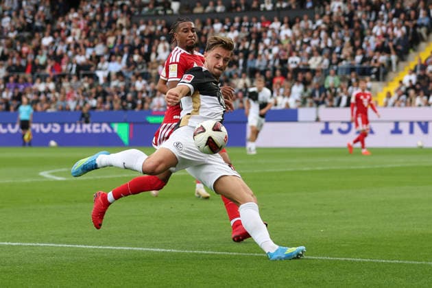 Lukas Petkov of SV 07 Elversberg and Michael Olise of FC Bayern Munich battle for the ball during the Bundesliga match between SV Elversberg and FC Bayern Munich at the Ursapharm Arena on September 13, 2026, in Spiesen-Elversberg, Germany. Photo by Oliver Kaelke, DeFodi Images. Lukas Petkov of SV 07 Elversberg and Michael Olise of FC Bayern Munich battle for the ball during the Bundesliga match between SV Elversberg and FC Bayern Munich at Ursapharm Arena on September 13, 2026 in Spiesen-Elversberg, Germany. Photo by Oliver Kaelke, DeFodi Images. DFB and DFL regulations prohibit any use of photographs as image sequences and or quasi-video. Photo by Oliver Kaelke, DeFodi Images.