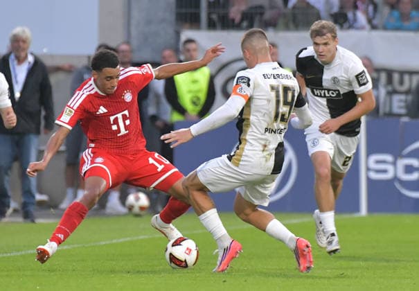 September 13, 2026, xblx, Soccer, Bundesliga 1, SV Elversberg vs. FC Bayern Munich – Jamal Musiala, FC Bayern Munich; Lukas Pinckert, SV 07 Elversberg. DFL and DFB regulations prohibit any use of photographs as image sequences and or quasi-video. Elversberg
