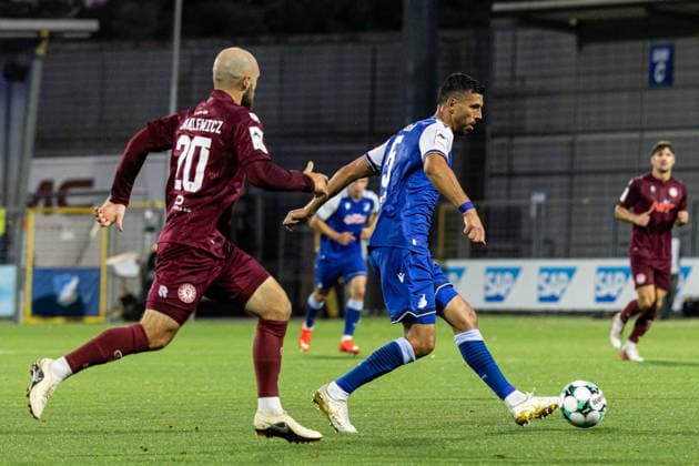 Germany: TSG Hoffenheim II vs. Fortuna Cologne, 3. Liga, 2026–27 season, Dietmar Hopp Stadium, Sinsheim; Klaus Gjasula, TSG Hoffenheim II, 5 on the ball; Adrian Stanilewicz, Fortuna Cologne, 20; Sinsheim; Dietmar Hopp Stadium; Baden-Württemberg; Germany Copyright: xBenedictxChristx