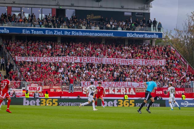 Elversberg, Germany, September 13, 2026, Bundesliga 1, 2026–2027 Season, Matchday 3: SV Elversberg vs. FC Bayern Munich. Pictured: Bayern fans with a banner in the visitors’ section. DFB and DFL regulations prohibit any use of photographs as image sequences and or quasi-video. URSAPHARM Arena an der Kaiserlinde Saarland Copyright: xFotostandx xSchäferx