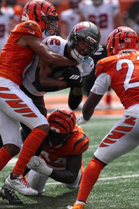 Sep 13, 2026; Cincinnati, OH, USA; Tampa Bay Buccaneers WR Emeka Egbuka (2) runs after the catch and gets tackled by Bengals players during WEEK 1 of the NFL, American Football Herren, USA regular season between the Cincinnati Bengals and the Tampa Bay Buccaneers at Paycor Stadium. Mandatory Credit: -Cal Media Cincinnati USA - ZUMAc04_ 20260913_zma_c04_112 Copyright: xKevinxSchultzx