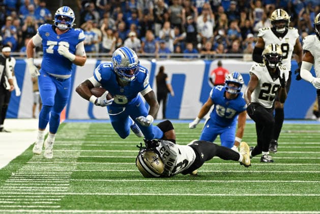 DETROIT, MI - SEPTEMBER 13: Detroit Lions running back Jahmyr Gibbs (0) is tackled by New Orleans Saints safety Julian Blackmon (23) after a long gain during the Detroit Lions versus New Orleans Saints game on Sunday September 13, 2026 at Ford Field in Detroit, MI. (Photo by Steven King Icon Sportswire) NFL, American Football Herren, USA SEP 13 Saints at Lions EDITORIAL USE ONLY Icon2582026091300177