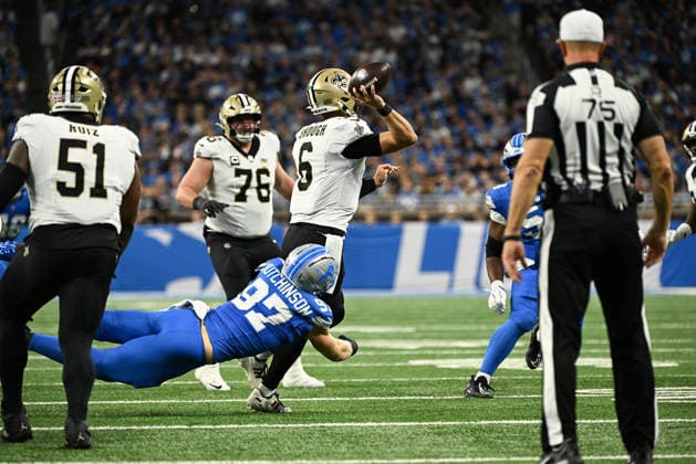 DETROIT, MI - SEPTEMBER 13: Detroit Lions defensive end Aidan Hutchinson (97) forces a bad throw from New Orleans Saints quarterback Tyler Shough (6) during the Detroit Lions versus New Orleans Saints game on Sunday September 13, 2026 at Ford Field in Detroit, MI. (Photo by Steven King Icon Sportswire) NFL, American Football Herren, USA SEP 13 Saints at Lions EDITORIAL USE ONLY Icon2582026091300351