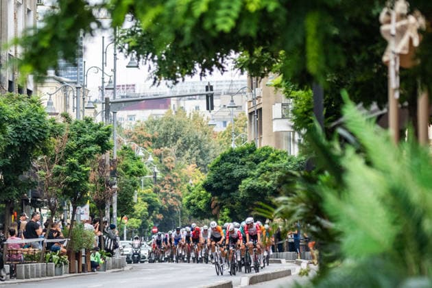 September 13, 2026, CYCLING TOUR OF ROMANIA, Stage 5 Bucharest Circuit 100 km, Bucuresti View of the peloton on Calea Victoriei boulevard with trees and people.