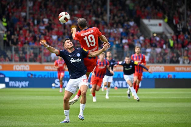 Heading duel, tackle, action: Adrian Kapralik (Holstein Kiel 20) vs. Jonas Foehrenbach (1 FC Heidenheim 1846 FCH 19); 1 FC Heidenheim 1846 FCH vs. Holstein Kiel KSV; September 13, 2026; DFL REGREGULATIONS PROHIBIT ANY USE OF PHOTOGRAPHS AS IMAGE SEQUENCES AND OR QUASI-VIDEO 1 FC Heidenheim 1846 FCH vs. Holstein Kiel KSV