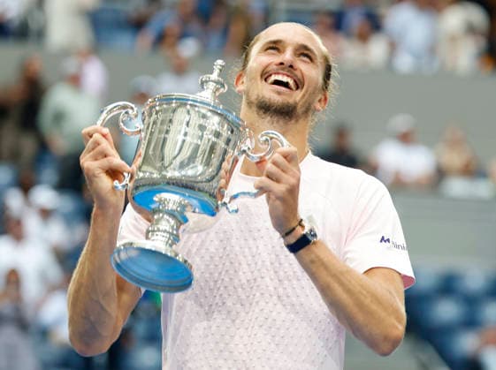Alexander Zverev of Germany raises the trophy after defeating Ben Shelton to win the Men s Finals match in Arthur Ashe Stadium at the 2026 US Open Tennis Championship at the USTA Billie Jean King National Tennis Center in New York City on Sunday, September 13, 2026. Zverev won 6-3, 7-6, 5-7, 6-2.  NYP20260913882 COREYxSIPKIN