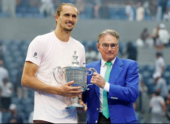 Tennis legend Jimmy Connors hands the winners trophy to .Alexander Zverev of Germany after the Men s Finals match in Arthur Ashe Stadium at the 2026 US Open Tennis Championship at the USTA Billie Jean King National Tennis Center in New York City on Sunday, September 13, 2026. Zverev defeated Ben Shelton to win 6-3, 7-6, 5-7, 6-2.  NYP20260913886 COREYxSIPKIN