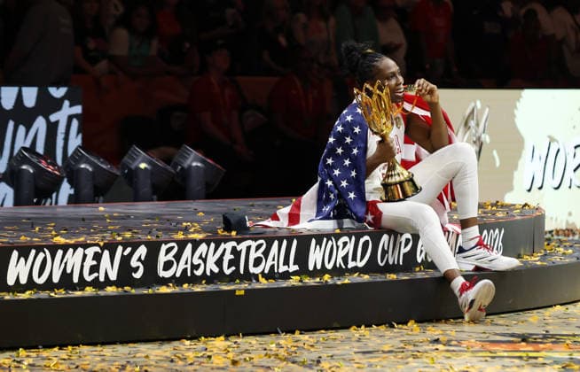 Chelsea Gray poses with her gold medal and the World Cup trophy, celebrating Team USA s World Championship victory. Joy, Emotion, Sports, Basketball, FIBA World Cup, Women s World Championship, World Championship Final, 2026–2027 Season, September 13, 2026, France vs. USA