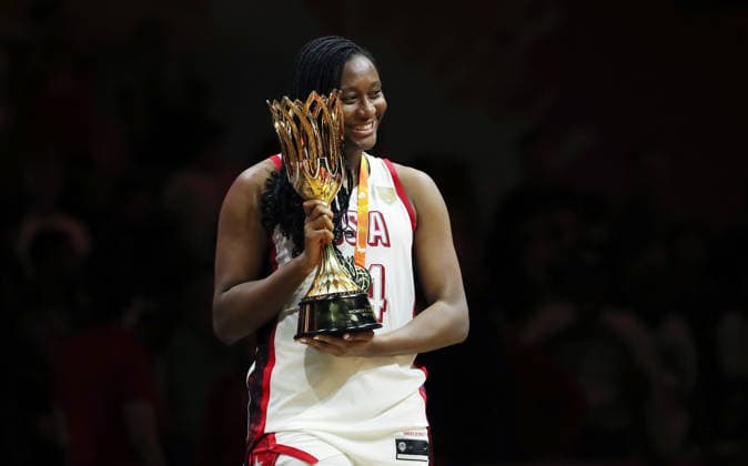 Aliyah Boston poses with her gold medal and the World Cup trophy, celebrating Team USA s World Championship victory. Joy, Emotion, Sports, Basketball, FIBA World Cup, World Championship, Women s World Cup, World Championship Final, 2026-2027 Season, September 13, 2026, France vs. USA