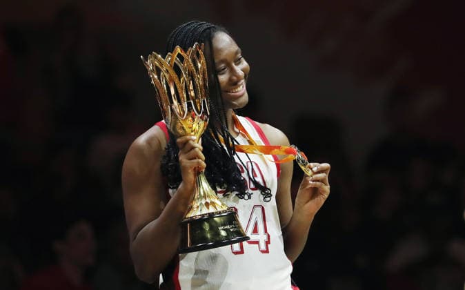 Aliyah Boston poses with her gold medal and the World Cup trophy, celebrating Team USA s World Championship victory. Joy, Emotion, Sports, Basketball, FIBA World Cup, World Championship, Women s World Cup, World Championship Final, 2026-2027 Season, September 13, 2026, France vs. USA